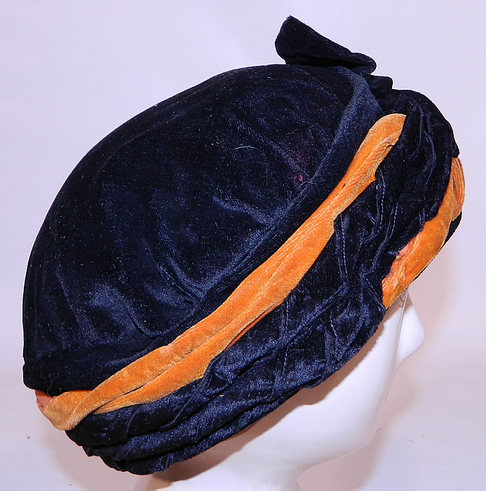 Vintage Art Deco Black & Orange Velvet Knotted Bow Trim Flapper Cloche Hat. The hat measures 22 inches inside circumference. It is in good condition. 