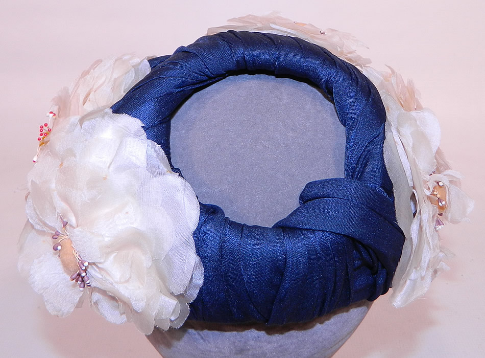 Vintage Rosa et Valentine Paris Label Blue Silk White Magnolia Flower Fascinator Hat.The hat measures 23 inches in circumference. 