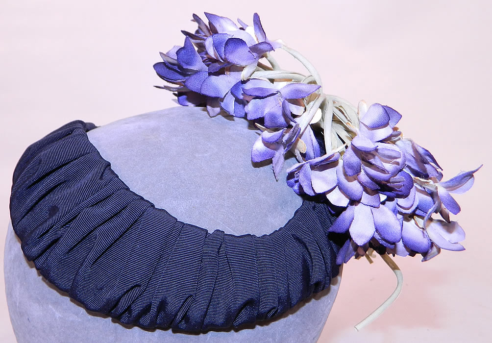 Vintage Black Silk Grosgrain Ribbon Purple Violet Flower Fascinator Hat
This vintage black silk grosgrain ribbon purple violet flower fascinator hat dates from the 1940s.