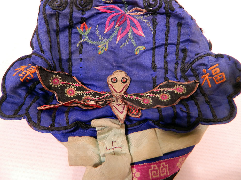 Antique Chinese Child Infant Silk Embroidered Butterfly Wind Hat Cap
These Han Chinese children's and infant hats were designed to provide protection from evil spirits, demons, and ghosts, but also to influence the wearer with important qualities such as wealth, health, courage, academic success, happiness, long life, grace and beauty. 