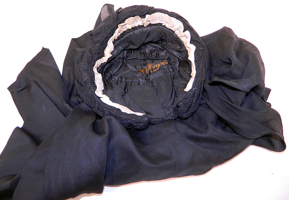 Victorian C.F. Hovey & Co Boston Label Black Silk Crepe Veil Full Mourning Bonnet Hat
This marvelous mourning bonnet has a layered veil which can be worn covering the face or folded back over the head and has a "C.F. Hovey & Co. Boston Paris" store label sewn inside.