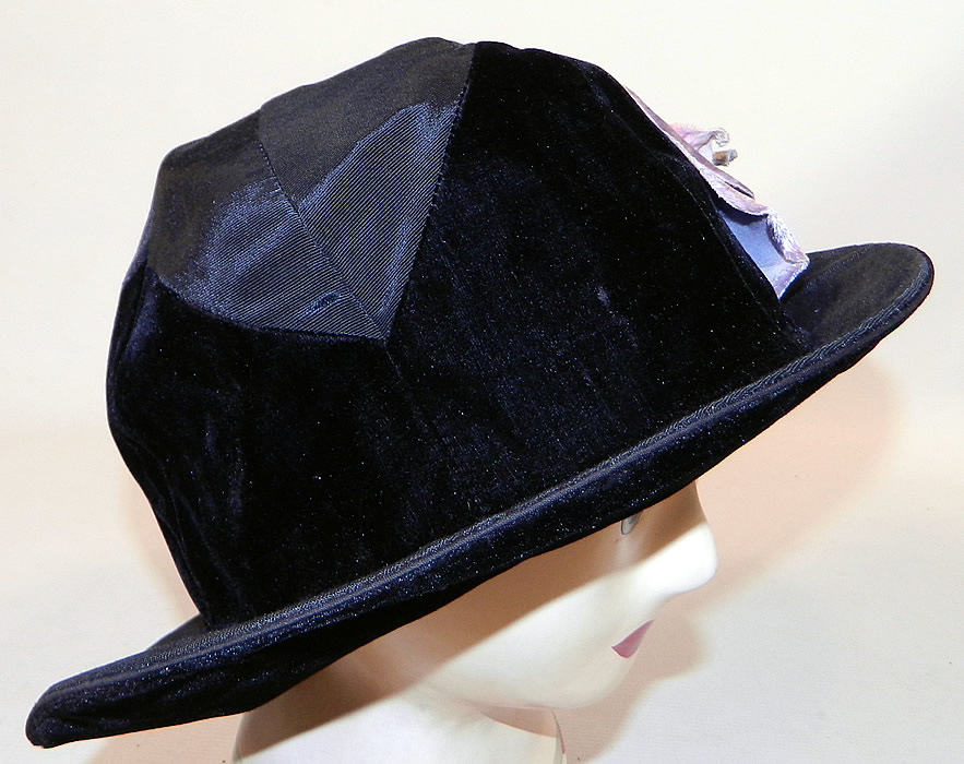 Vintage Hart Hats Black Silk Velvet Wide Brim Purple Flower Flapper Cloche Hat
It is made of a two tone black silk and velvet fabrics, with a large varying shades of purple velvet fabric flower trim on the side. 