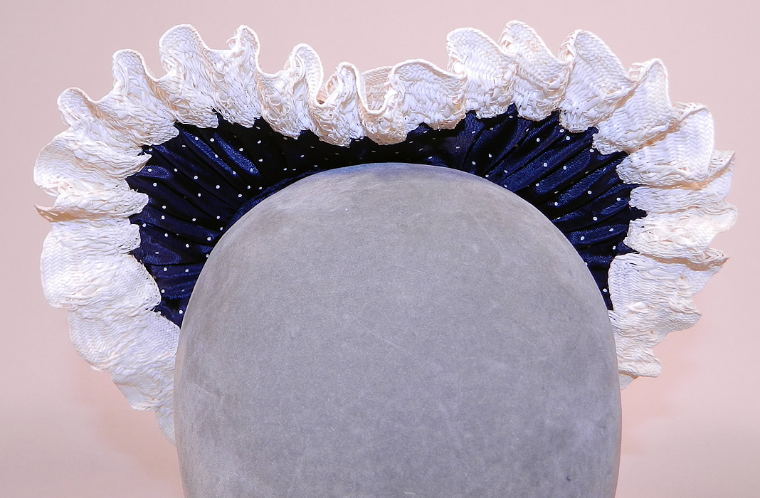 Vintage Navy Blue White Polka Dot Woven Straw Bow Heart Shape Fascinator Hat
This vintage navy blue white polka dot woven straw bow heart shape fascinator hat dates from the 1940s.