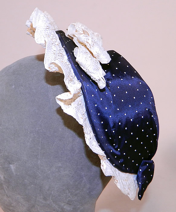 Vintage Navy Blue White Polka Dot Woven Straw Bow Heart Shape Fascinator Hat
It is made of a navy blue and white polka dot fabric, with a white woven straw ruffle trim edging and bow accents on the back top & bottom. 