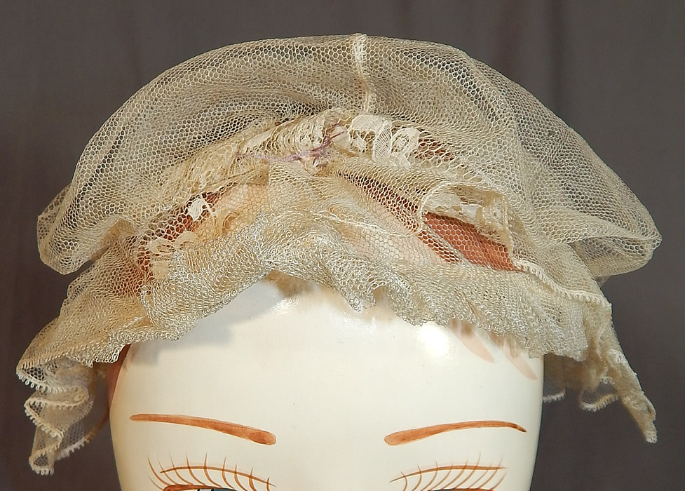 Victorian Civil War Era Antique Cream Net Lace Bed Cap Morning Bonnet Hat
It is made of a sheer fine off white cream color tulle net fabric, with Chantilly lace ruffle trim wired edging encircling the head. 