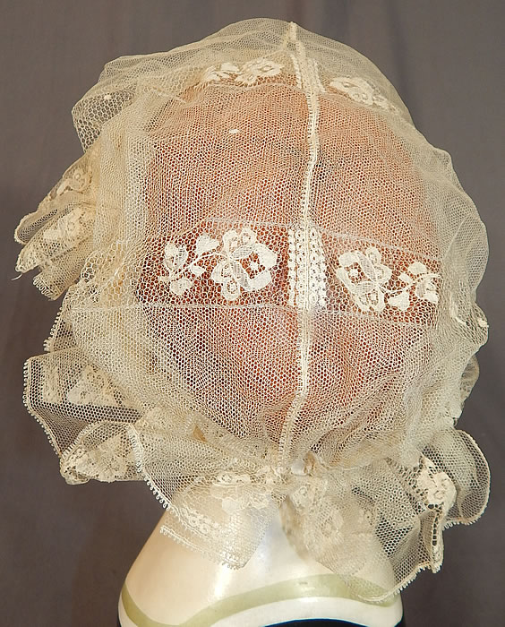 Victorian Civil War Era Antique Cream Net Lace Bed Cap Morning Bonnet Hat
This lovely lace has been created into a boudoir bed cap morning bonnet hat with a muffin top cap style, attached net chin strap and is sheer, unlined. 
