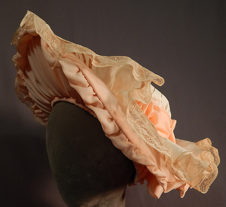 Victorian Style Ruth Stockley Society Silk Embroidery Floral Peach Bonnet Hat
The hat is hand made by the late milliner Ruth Stockley in the 1980s, she was the foremost authority on the design and construction of 20th century millinery. 