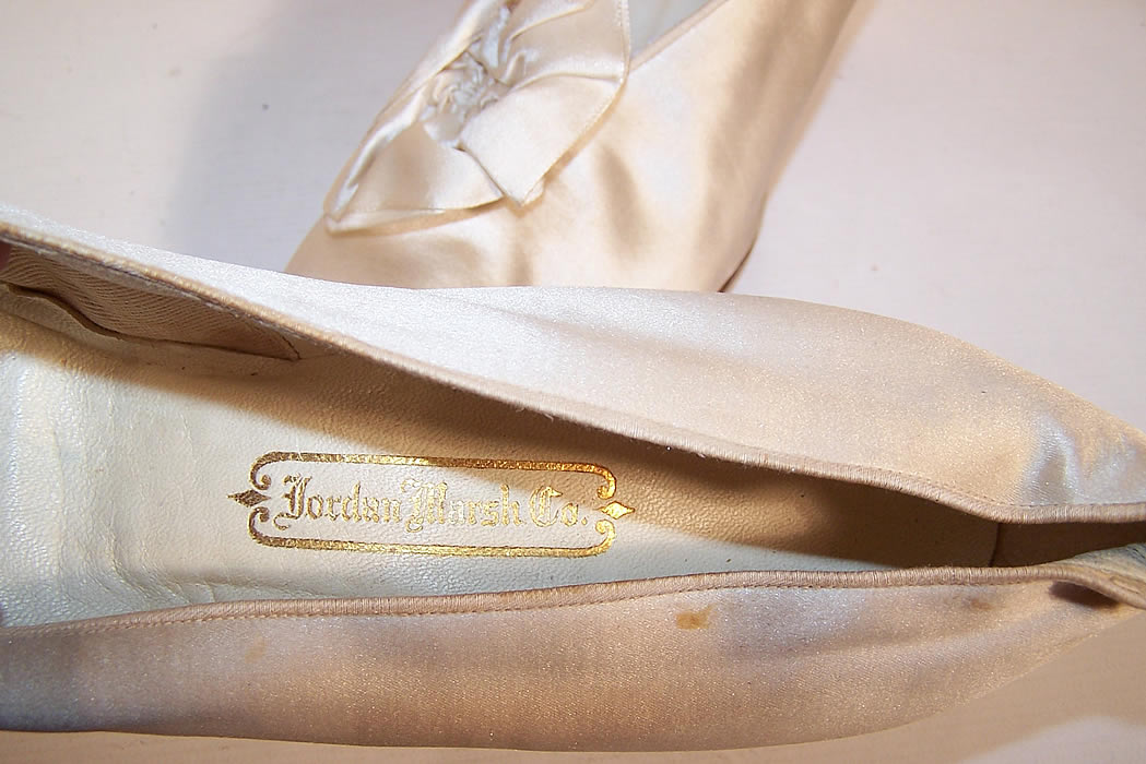 Edwardian Jordan Marsh Co. White Silk Rosette Bridal Wedding Shoes are lined in kid leather with gold embossed lettering from the "Jordan Marsh Co." inside.