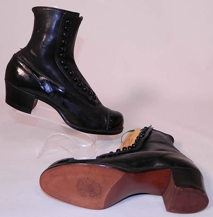 Victorian Unworn Vintage Welteze Shoes Black Leather High Button Boots. The boots have rounded toes, 14 black shoe buttons along the side for closure and stacked wooden cube heels.