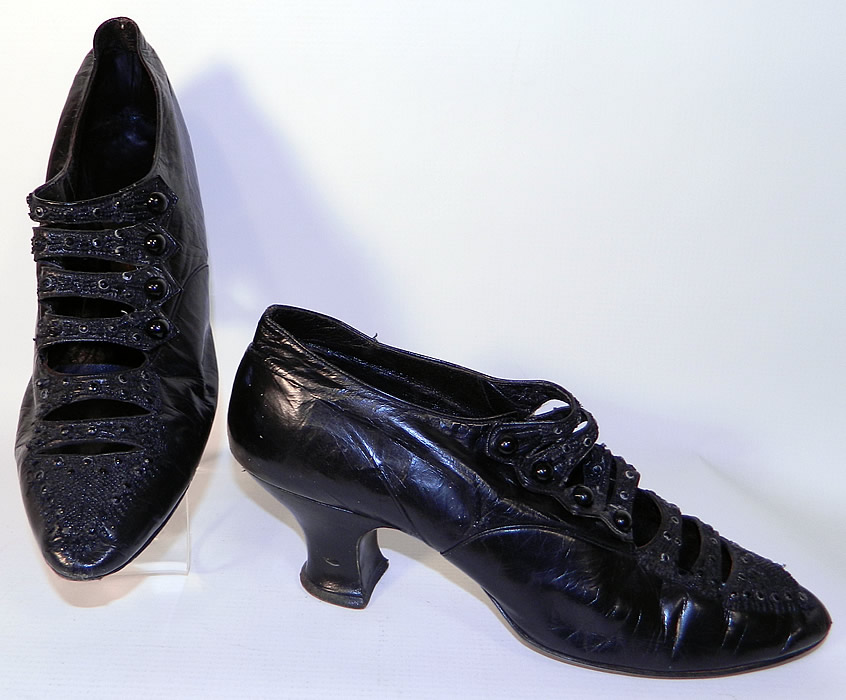 Vintage Sorosis  Edwardian Titanic Era Black Beaded Button Strap Shoes. This pair of vintage Sorosis Edwardian Titanic era black beaded button strap shoes date from 1912. They are made of black leather, with jet beading done in a decorative pattern design on the front toes vamps and instep. 