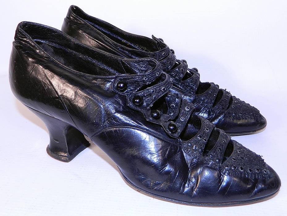 Vintage Sorosis  Edwardian Titanic Era Black Beaded Button Strap Shoes. These elegant evening shoes have an open cut out strap design, with 4 black shoe buttons on each, pointed toes and French Louis XV spool heels.