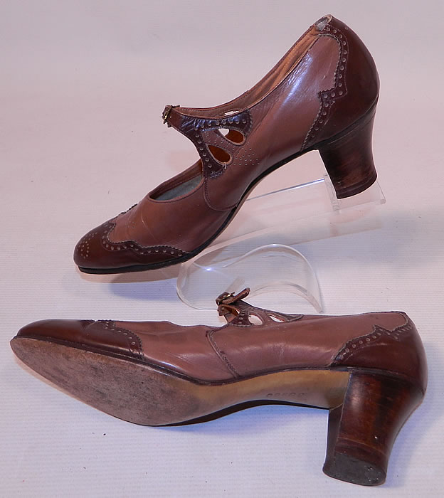 Vintage Two Tone Punchwork Brown Leather Buckle Strap Mary Jane Shoes. The shoes measure 10 1/2 inches long, 2 3/4 inches wide, with 2 1/2 inch high heels. They have  been gently worn and are in good condition. These are truly a wonderful piece of wearable Art Deco shoe art! 