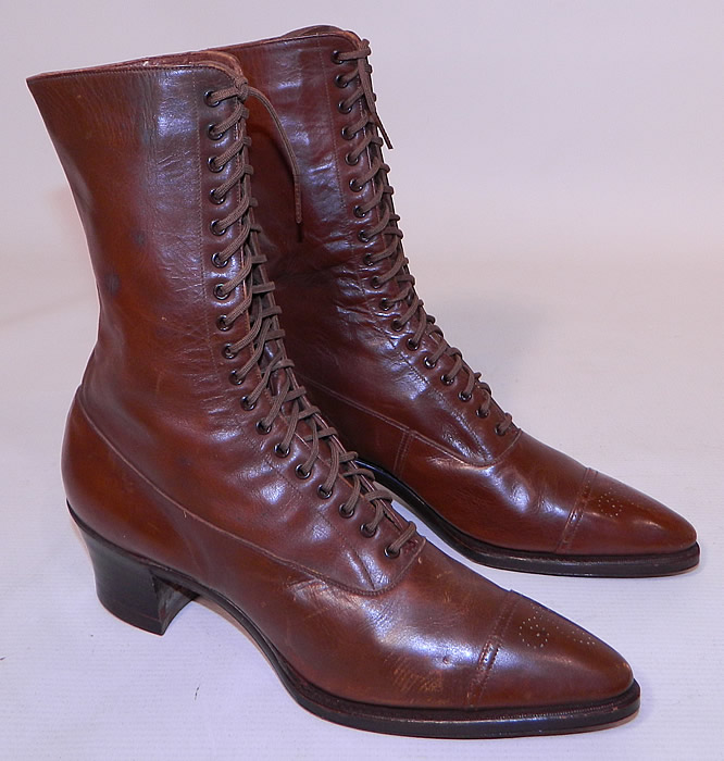 Unworn Victorian Brown Leather High Top Lace-up Boots Poehlman Shoe Co. This pair of unworn antique Victorian era brown leather high top lace-up boots Poehlman Shoe Co. dates from 1900.