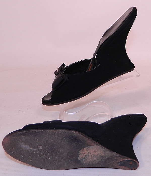 Vintage Black Suede Leather Rhinestone Bow Springolator Wedge Heel Mules Shoes. They are in good condition and have been gently worn. These are truly a rare and wonderful piece of wearable shoe art!