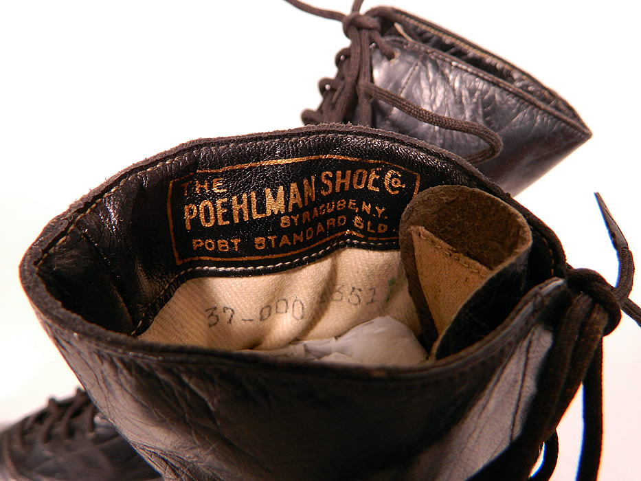 Vintage Poehlman Shoe Co Unworn Victorian Black Leather High Top Lace-up Boots. They are stamped inside "The Poehlman Shoe Co. Syracuse, N.Y." and on the bottom soles "John Gray". The boots measure 9 inches tall, 10 1/2 inches long, 2 1/2 inches wide, with 2 inch high heels. 