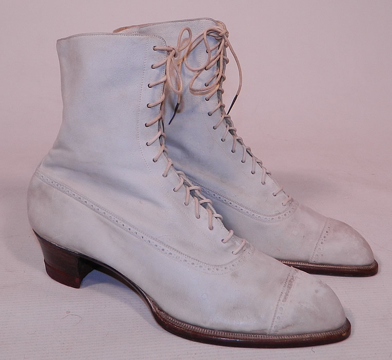 Vintage Nihleen NY Label Victorian White Suede Leather High Top Lace-up Boots
The boots measure 7 1/2 inches tall, 10 inches long, 3 inches wide, with 1 1/2 inch high heels.