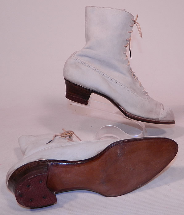 Vintage Nihleen NY Label Victorian White Suede Leather High Top Lace-up Boots
These antique boots are difficult to size for today's foot, but my guess would be about a US size 7 narrow width. They are old store stock, in good unworn condition, with only some slight soiling scuff marks on the toes and heels from display & storage. These are truly a rare and beautiful quality made antique boot!