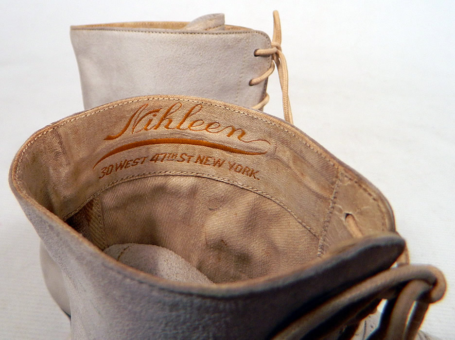 Vintage Nihleen NY Label Victorian White Suede Leather High Top Lace-up Boots
The boots have pointed toes, the original white shoe string laces for closure and stacked wooden cube heels. They are fully lined and have a "Nihleen 30 West 47th Street New York" label inside.