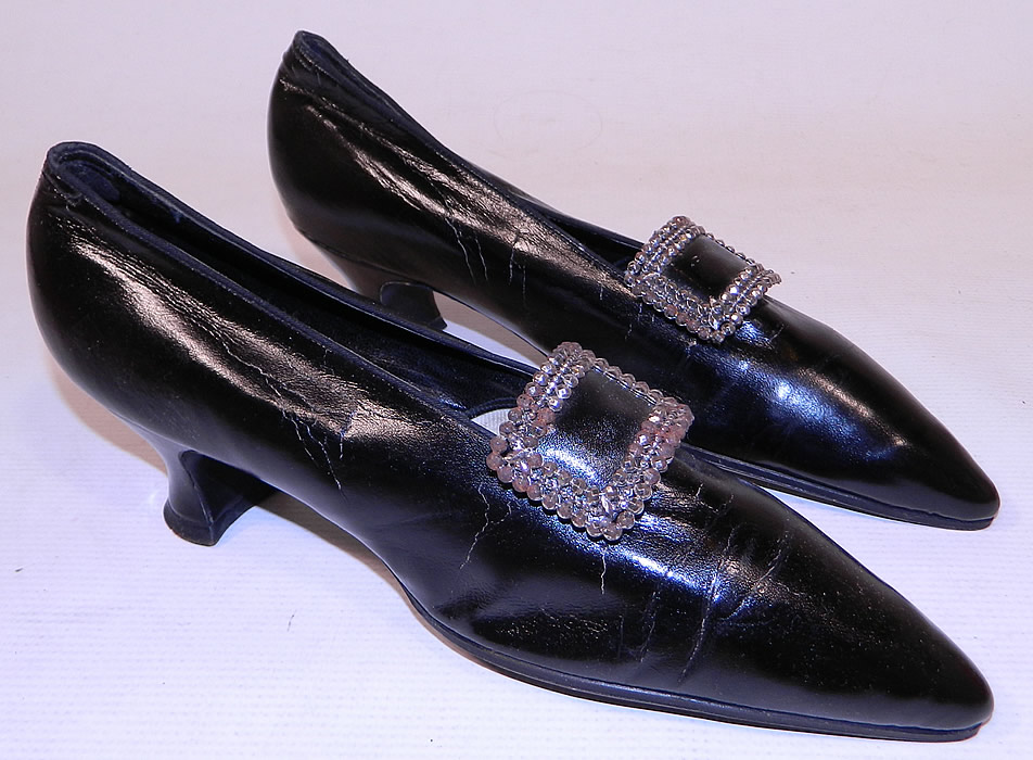 Edwardian Hanan & Son NY Black Patent Leather Steel Cut Buckle Shoes & Shoe Bag
They are made of a black patent leather, with decorative steel cut silver beaded buckle trim shoe clips on the front vamps.