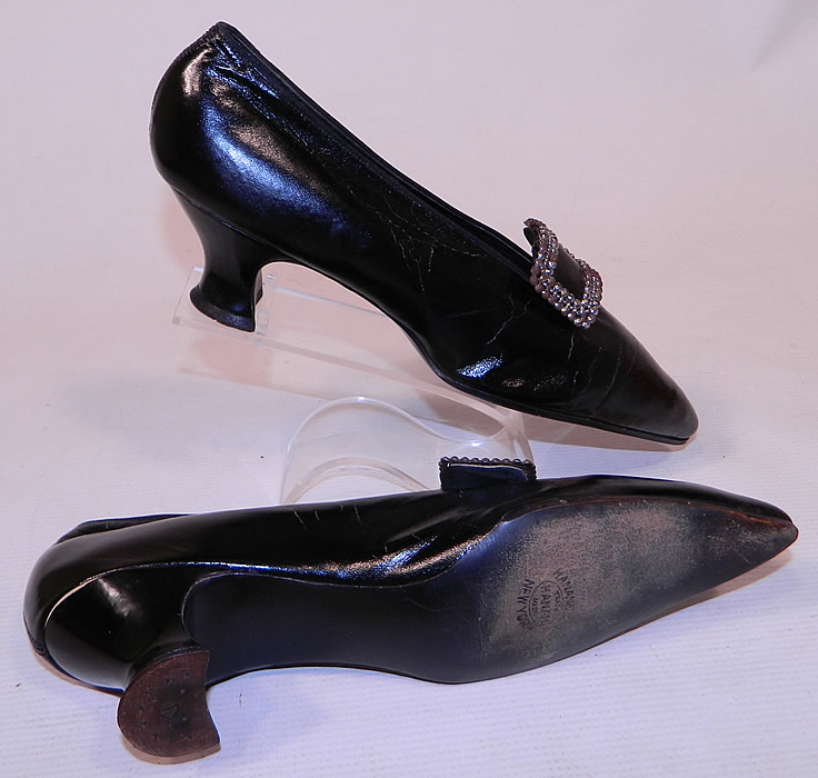 Edwardian Hanan & Son NY Black Patent Leather Steel Cut Buckle Shoes & Shoe Bag
These elegant evening shoes have a slip on slipper style, with exaggerated pointed toes and leather covered Louis XV French heels.