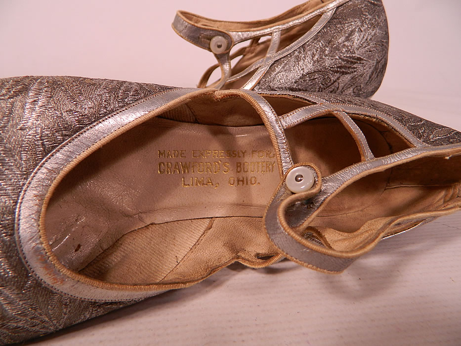 Vintage Silver Leather Lamé Lame Brocade Button Strap Mary Jane Flapper Shoes
They are lined and have a "Made Expressly For Crawford's Bootery Lima, Ohio" label inside. 