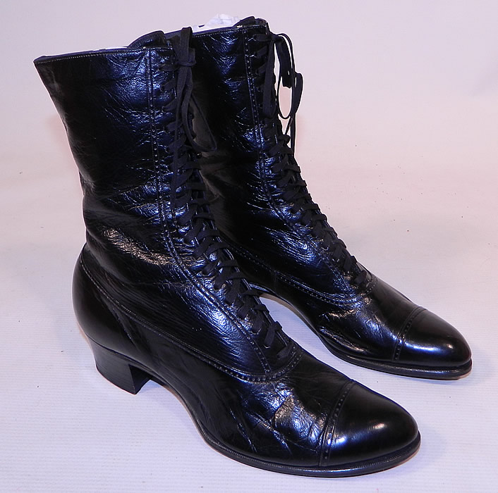 Unworn Victorian Vintage Patrician Label Black Leather High Top Lace-up Boots
These beautiful black boots have rounded toes, the original black shoe string laces for closure and black stacked wooden cube heels.