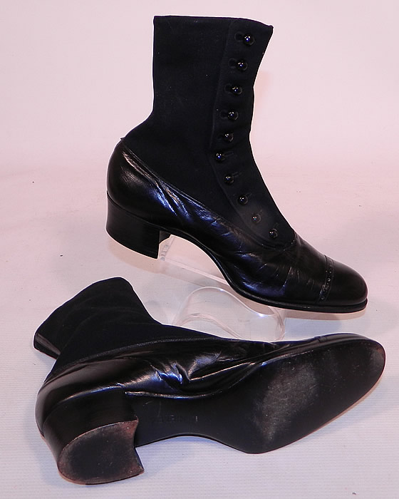 Victorian Black Wool & Leather High Top Button Boots T.E. Moseley Co. Boston
These beautiful boots have rounded toes with decorative punch work design, 10 black shoe buttons along the side for closure and stacked black wooden cube heels.