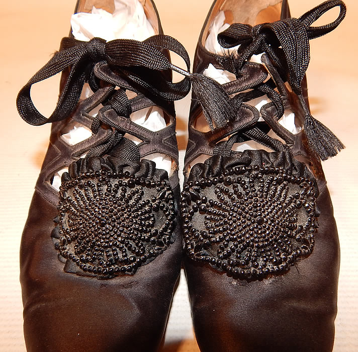 Vintage Thayer McNeil Co Boston Black Silk Beaded Buckle Eyelet Flapper Shoes
The shoes measure 9 1/2 inches long, 3 inches wide, with a 2 inch high heel.