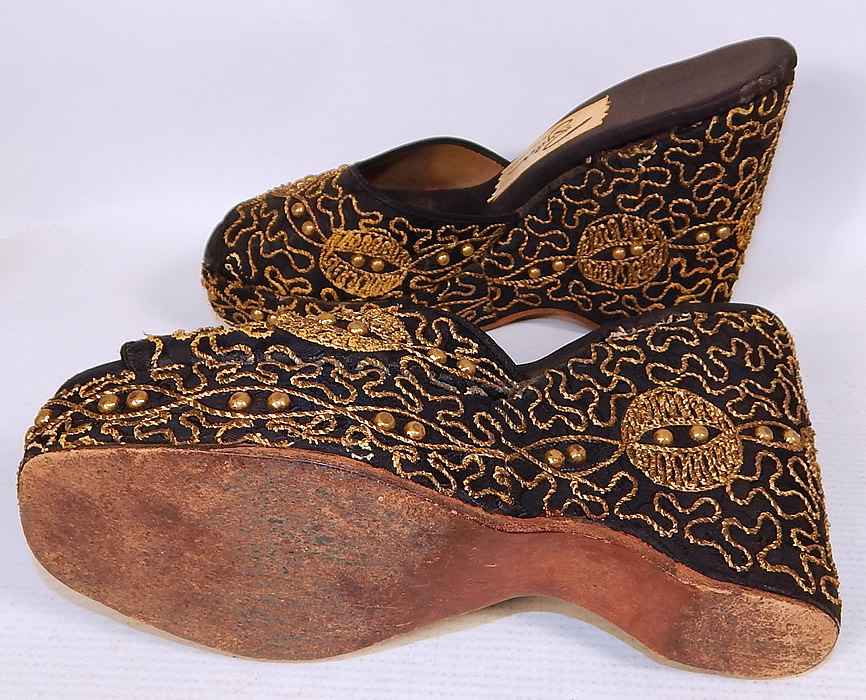 Vintage Ryder of California Black Gold Studded Soutache Wedge Heel Platform Shoes
They are in good condition and have been gently worn, with only a few loose threads, slight cuffs on the front toes.