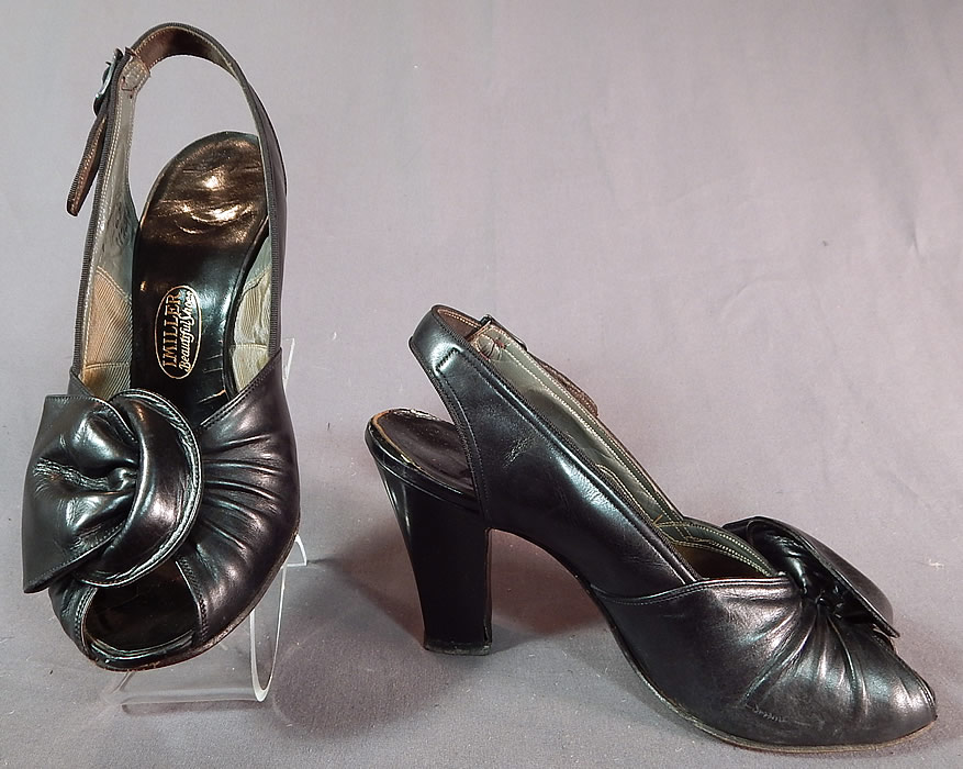 Vintage I. Miller Black Patent Leather Sling Back Peep Toe Pumps Pinup ShoesThey have been gently worn and are in good condition. These are truly a wonderful piece of quality made wearable shoe art!