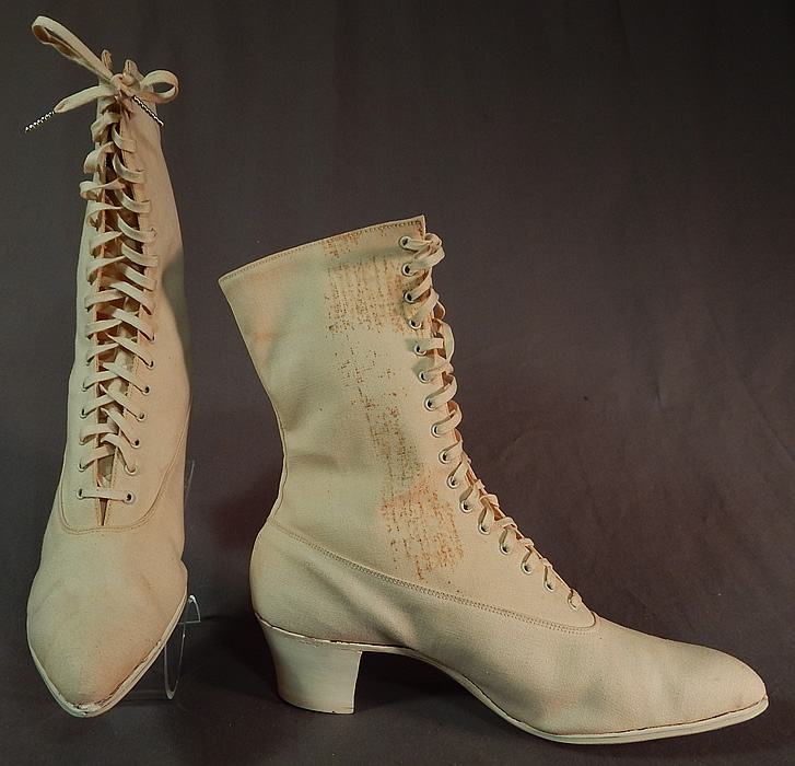 Edwardian Womens White Cotton Canvas High Top Laceup Athletic Boots Sport Shoes
The boots measure 9 inches tall, 11 inches long, 3 inches wide, with 2 inch high heels. These antique boots are difficult to size for today's foot, but my guess would be about a US size 8 narrow width.