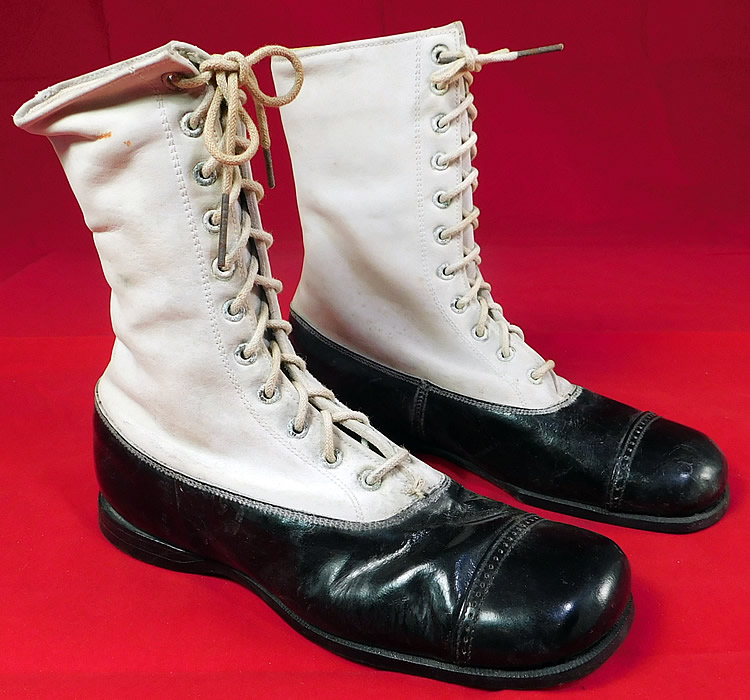 Unworn Vintage Doctor Deans Edwardian Two Tone Black & White Leather High Top Boots
This pair of unworn Edwardian era vintage Doctor Deans two tone black and white leather high top boots date from 1915. They are made of a two tone color white leather upper boot and a black patent leather bottom shoe. 