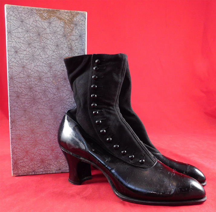 Unworn Edwardian Black Cloth Patent Leather High Top Button Boots & Shoe Box
This pair of unworn antique Edwardian era black cloth patent leather high top button boots and shoe box date from 1910. They are made of black wool cloth fabric upper boot and a black patent leather lower shoe. 