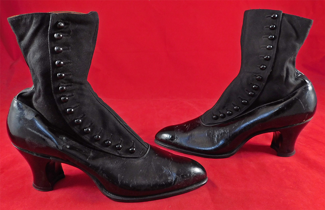 Unworn Edwardian Black Cloth Patent Leather High Top Button Boots & Shoe Box
These womens beautiful black boots have a pointed toe, 14 black shoe buttons along the side for closure and black patent leather covered French spool heels. They come in the original shoe box covered with a wonderful spider web cobweb graphics foil paper from "The Harris Shoe Store" in Dover, New Jersey and are stamped on the outside of the box a European size 37. The boots measure 9 inches tall, 10 1/2 inches long, 3 inches wide, with 2 1/2 inch high heels. 