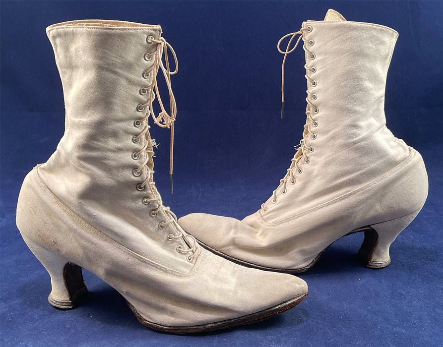 Victorian Antique White Canvas High Top Lace-up Boots French Spool Heels
This pair of antique Victorian era white canvas high top lace-up French spool heel boots date from 1900. They are made of a white cotton canvas twill fabric. 