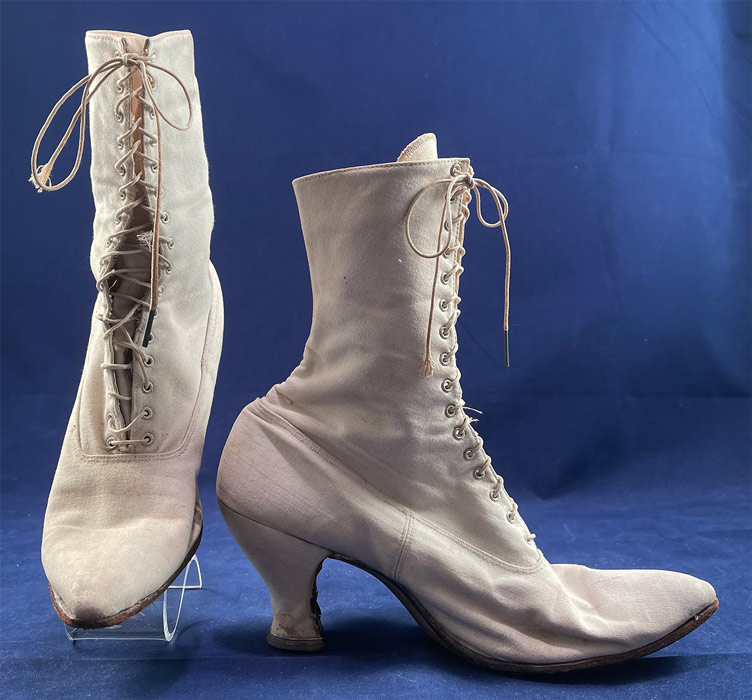 Victorian Antique White Canvas High Top Lace-up Boots French Spool Heels
These antique boots are difficult to size for today's foot and are approximately a US size 7 narrow width.