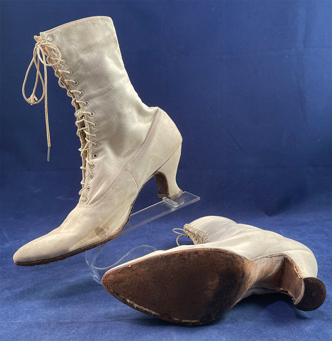 Victorian Antique White Canvas High Top Lace-up Boots French Spool Heels
They are in good wearable condition, have been worn with wear on the bottom leather soles and some small faint stains. These are truly a wonderful piece of quality made wearable shoe art.