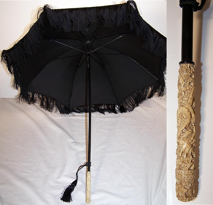 Victorian Black Silk Mourning Parasol Dragon Carved Handle close-up view.