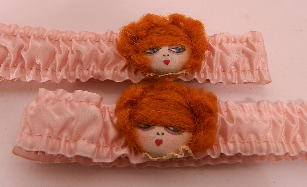 Unworn Vintage Pink Silk Hand Painted Red Head Flapper Girl Garters.  These fabulous flapper girl garters have pleated gathered elastic bands to hold up stockings or to carry small valuables, including flasks during Prohibition. 