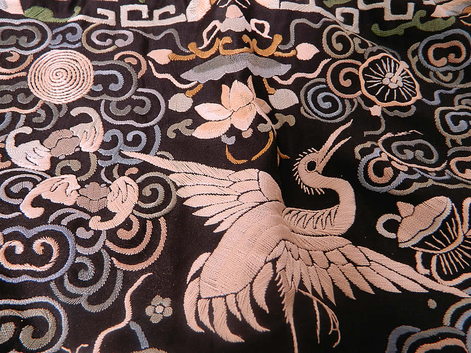 Antique Chinese Silk Embroidered Crane Bird First Rank Badge Tassel Trim. There is a white crane bird in the center, with the Eight Buddhist symbols of good fortune, bats, butterflies and waves of water along the bottom. 