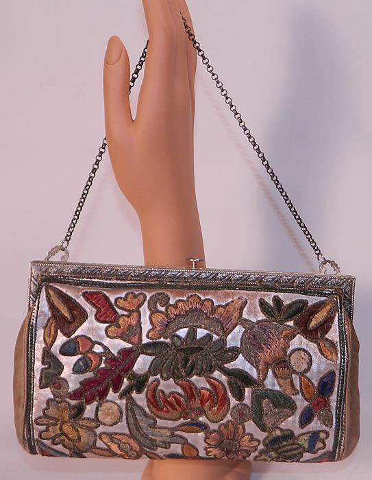 Vintage Art Deco Floral Stumpwork Embroidered Silver Leather Evening Purse. The purse measures 9 inches long and 5 inches wide. 