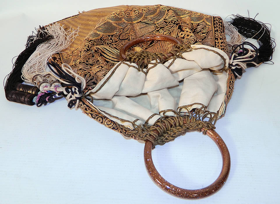 Antique Chinese Gold Couching Paradise Flycatcher Bird 9th Rank Badge Purse. The buzi badge is of the paradise flycatcher which is the symbol of the ninth civil rank badge which has been beautifully embroidered and sewn together made into a purse and has a two gold glitter glass ring handles on top for carrying. 