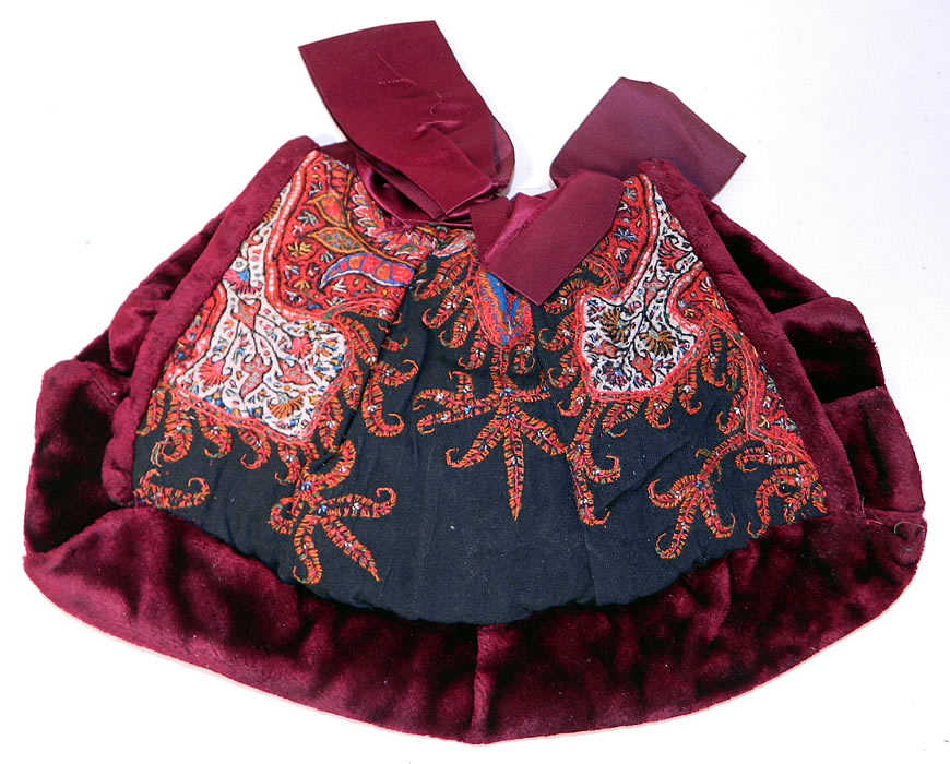 Antique Kashmir Hand Embroidered Woven Wool  Paisley Velvet Winter Muff. It is made of colorful soft Kashmir wool hand embroidered and pieced together in a paisley pine cone shaped tear drop motif boteh and decorative floral leaf designs, with a dark red burgundy color plush velvet fabric. 