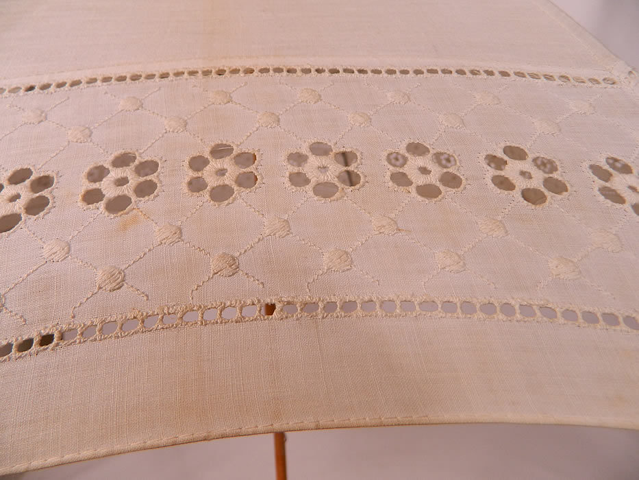 Edwardian White Linen Eyelet Burl Wood Handle Summer Pagoda Parasol.  It is in good usable condition, but has not been cleaned, with some faint age spotting, yellowing staining along the folds. This is truly a wonderful parasol perfect for an Edwardian era ladies summer outing!