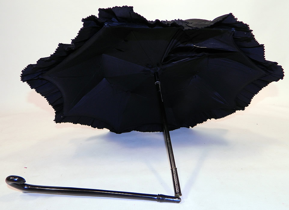 Victorian Civil War Black Silk Ebony Folding Handle Marquis Mourning Parasol
There is a black ebony wood carved handle and folding shaft, with a marquis tilt top mechanism inside to keep the sun off your face. 