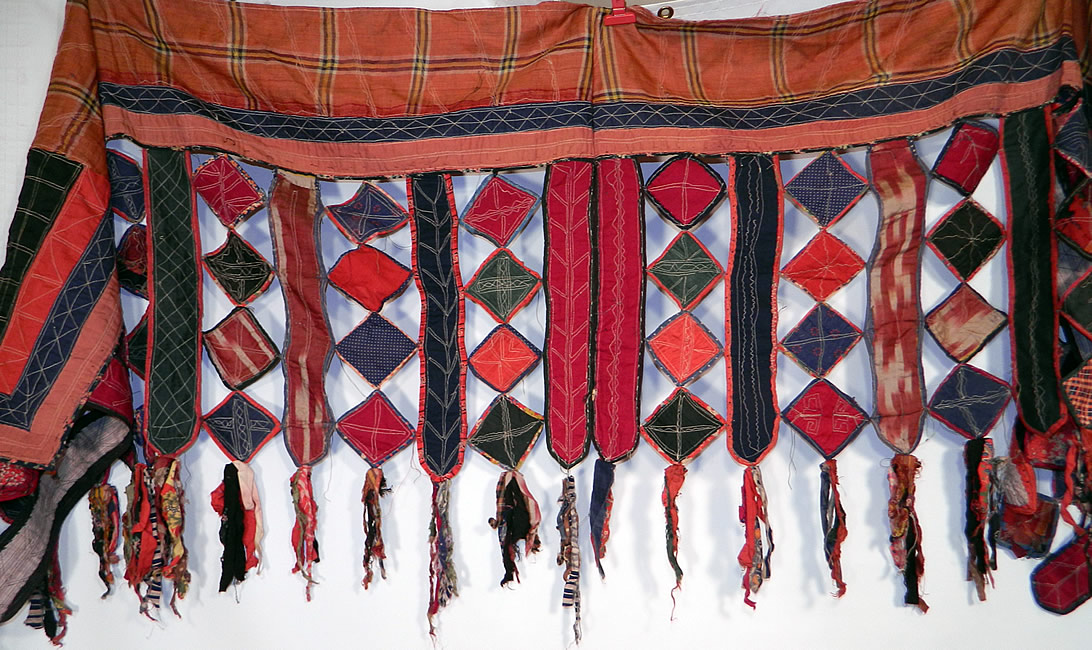 Antique Uzbekistan Tajik Ikat Patchwork Quilt Fabric Textile Door Curtain Wall Hanging
There are hand embroidered decorative stitching quilted details with fringed fabric ragged tassel ends. 