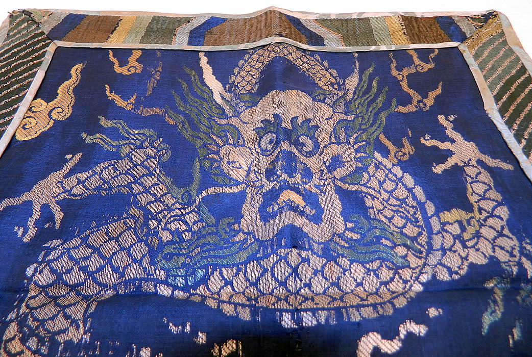 Antique Chinese Silk Damask Weave Brocade Fabric Mangpao Dragon Square Badge Textile
It is made of a blue silk damask weave brocade fabric with a colorful thread woven design. There is a "mang" four clawed dragon, with smoke clouds, a pearl and fire flames. 