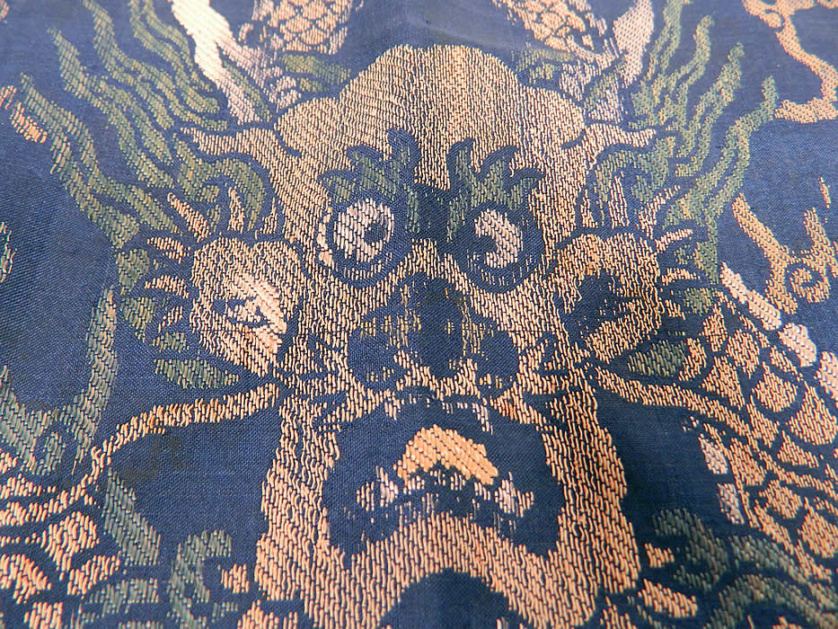 Antique Chinese Silk Damask Weave Brocade Fabric Mangpao Dragon Square Badge Textile
This fabric might have been part of an Imperial Manchu Mangpao dragon robe and has been cut into a square badge, with a silk striped woven fabric trim border edging and backed in a blue cotton fabric. 