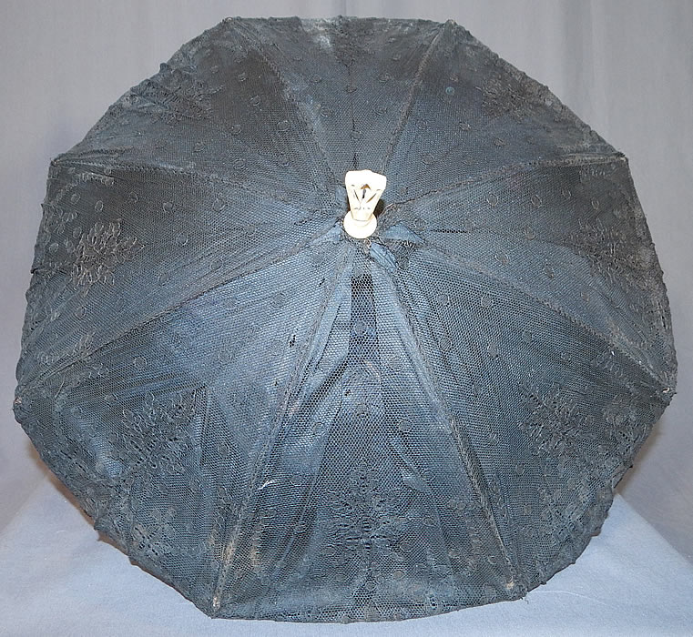 Victorian Antique Black Chantilly Lace Carved Pierced Finial Handle Parasol
The parasol measures 23 inches long, with a 6 inch long bone handle and is 55 inches in circumference when opened up.