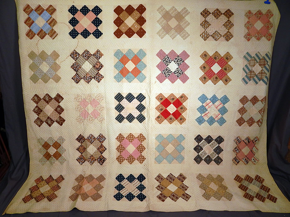 Victorian Antique Chintz Calico Cotton Fabric 12 Patch Square Block Quilt
This early Victorian era antique chintz calico cotton fabric 12 patch square block quilt dates from 1850. It is all hand stitched, with a white cotton background, made up of a variety of colorful chintz, calico cotton fabric pieces.